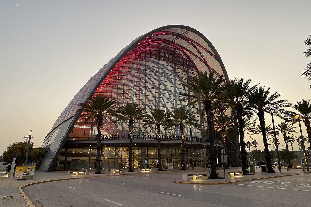 The arched glass front of the Anaheim Regional Transportation Intermodal Center (ARTIC) at dusk in Anaheim, California